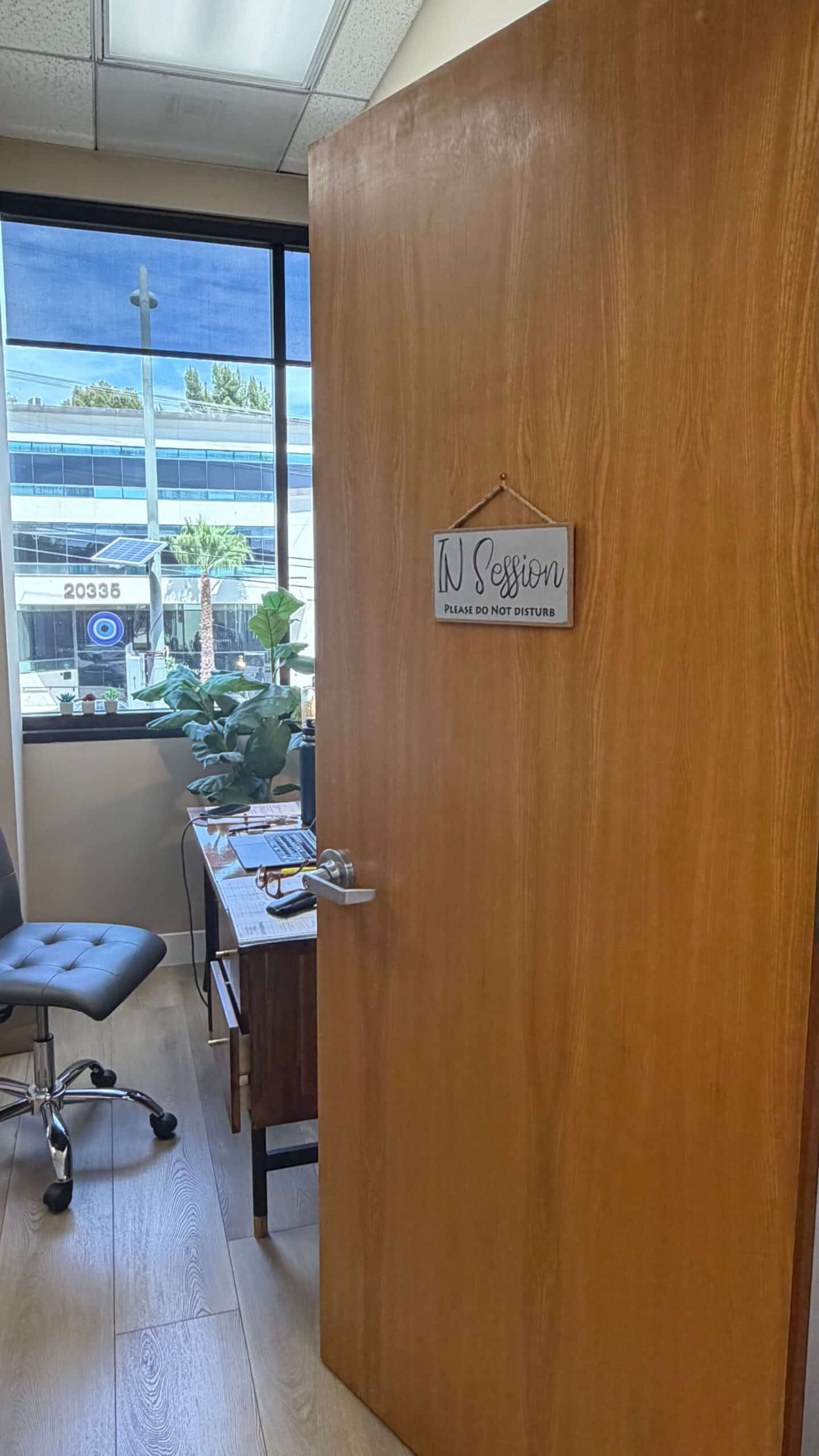 In Session door sign and window view at Launch To Wellness