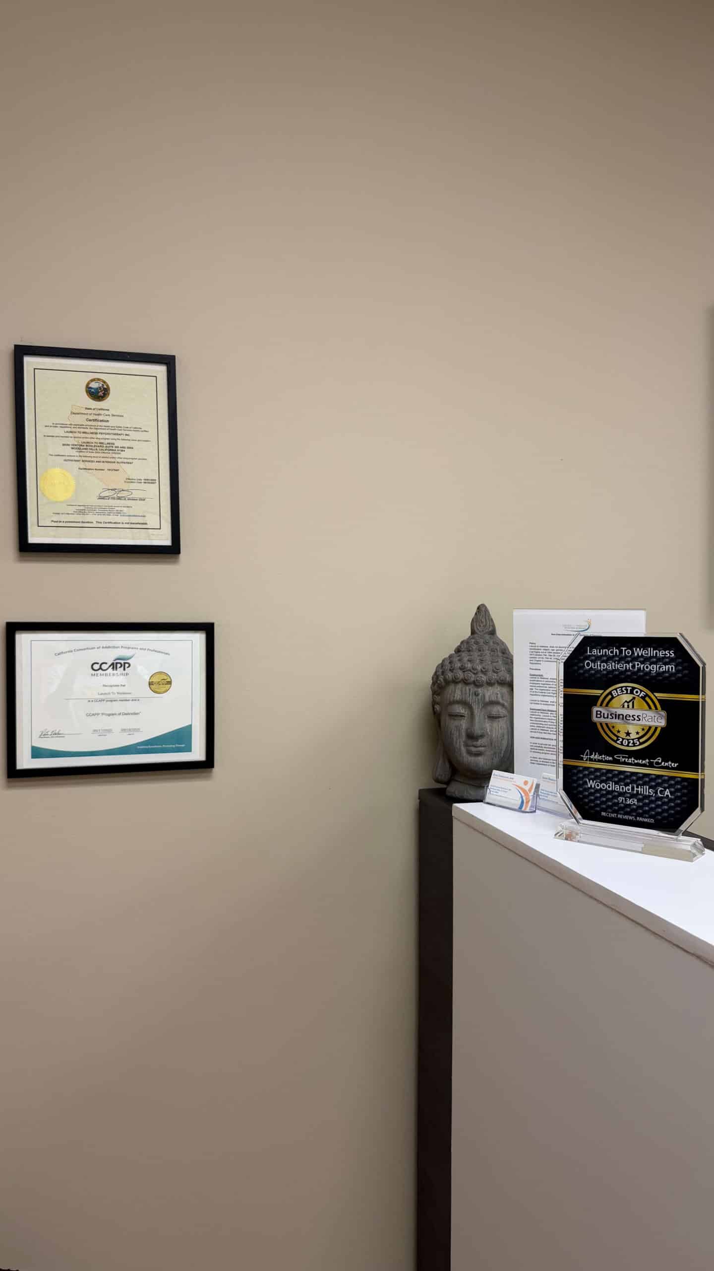 Framed professional certificates on the wall