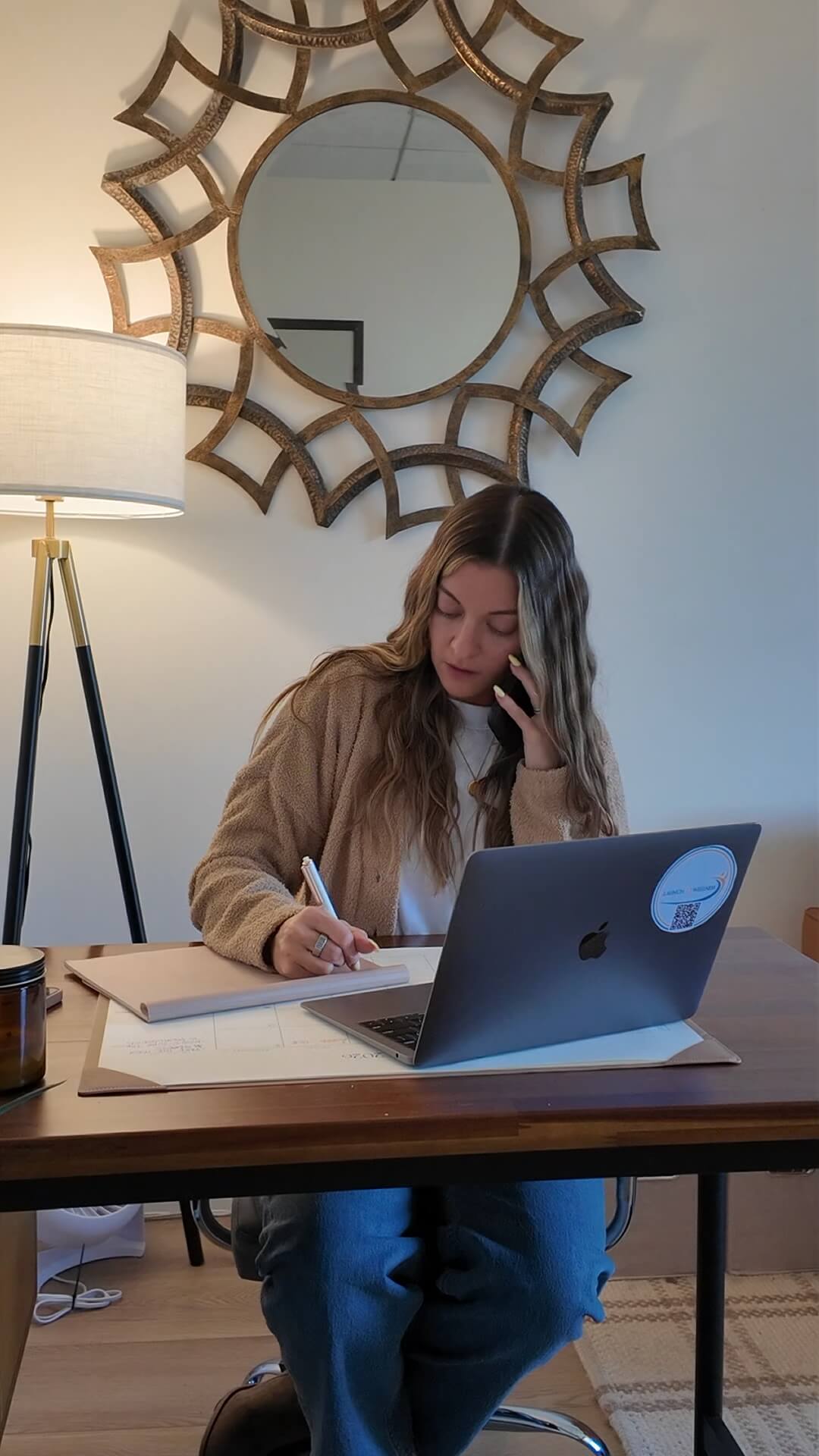 A Launch To Wellness team member taking notes during an admissions call