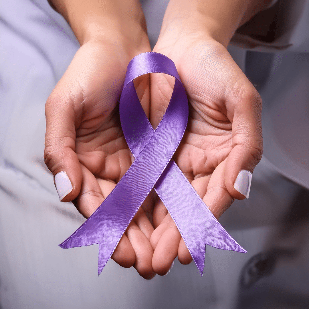 Hands holding a purple ribbon, the symbol of the George's Wings Scholarship